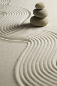 Stack of stones on raked sand